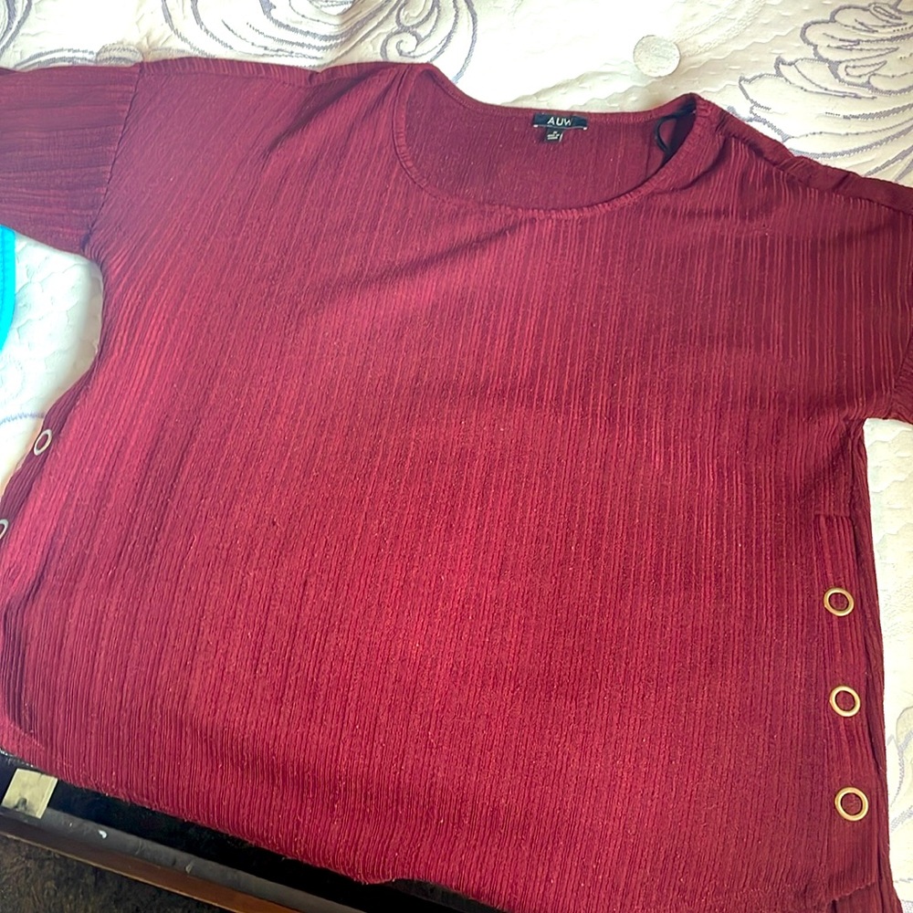 Deeper wine color in person, pretty new worn once! Fancy feeling material.